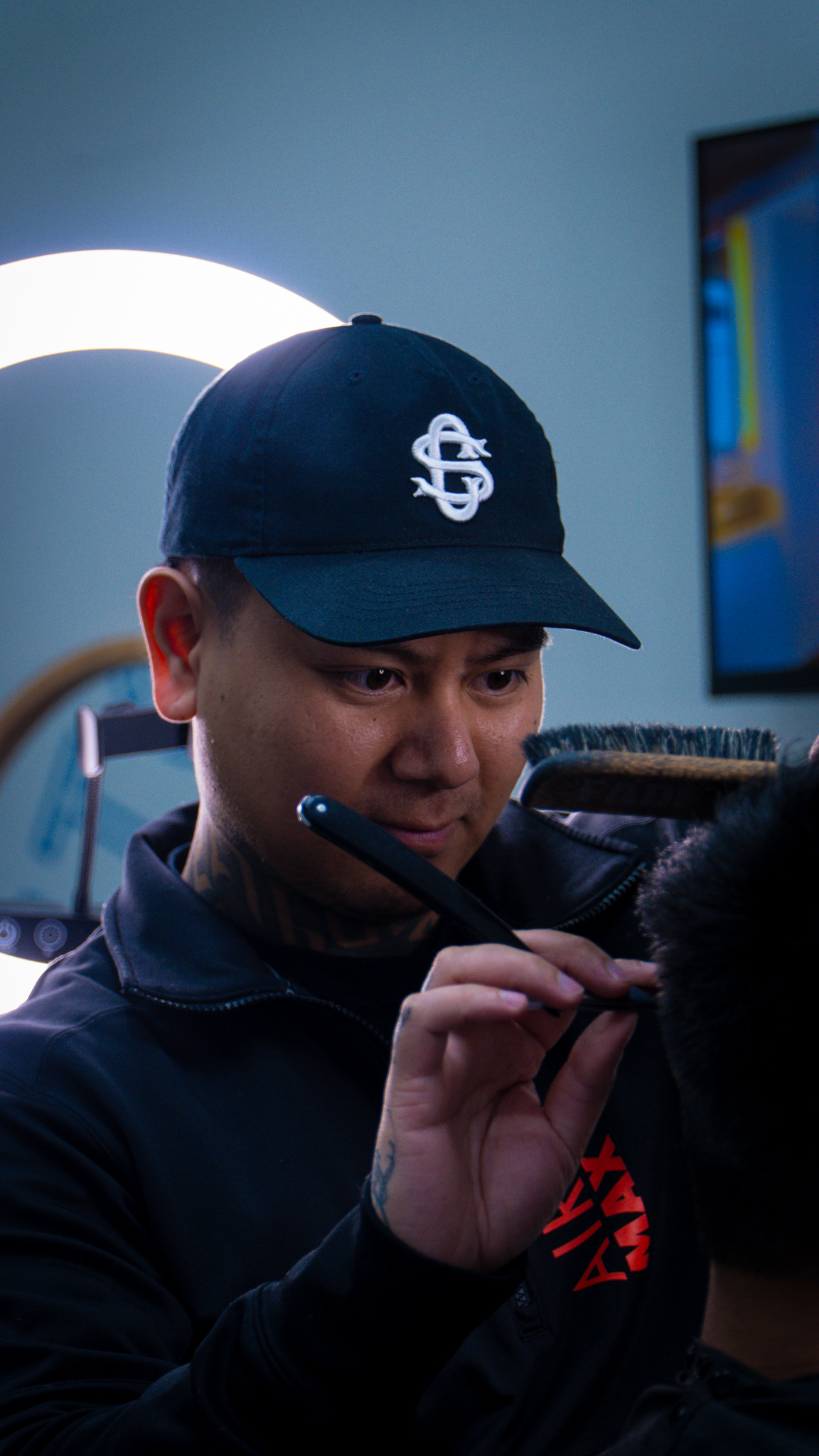 Barber shaving client with straight razor
